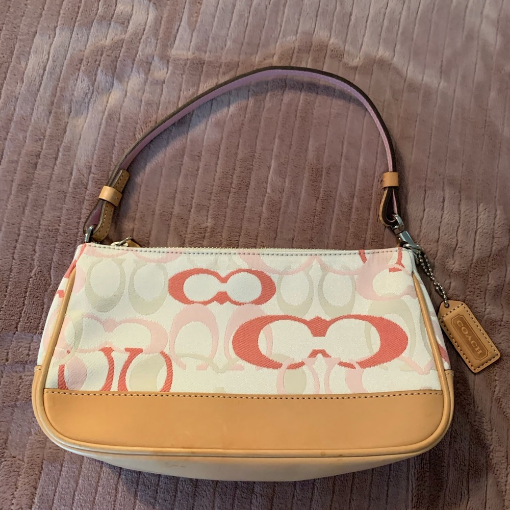 Coach pink and white canvas mini purse.